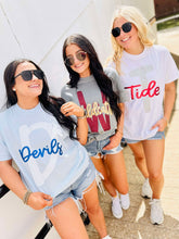 Load image into Gallery viewer, Three women wearing t-shirts with 'Devils', 'W', and 'Tide' glitter puff text, standing outdoors.
